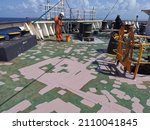 Small photo of 19 January 2022 at sea. A ship crew is painting forecastle deck on q bulk carrier.