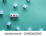 Small photo of There is white cube with the word XML. It is as an eye-catching image.