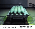 Old combat torpedoes for submarines in an underground storage bunker