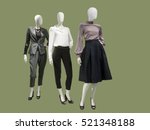 Three female mannequins dressed with fashionable modern clothes, isolated. No brand names or copyright objects.