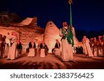 Small photo of Riyadh, Saudi Arabia – April 21st, 2023: Group of Saudi Arabian men perform a traditional and cultural dance called Ardah in the historical Diriyah city at Traif district the most attractive tourism
