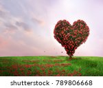Tree of love in spring. Red heart shaped tree at sunset. Beautiful landscape with flowers.Love background
