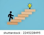 Stickman climbing steps towards a light bulb. Concept of success Growth and development, creativeness or idea formation.               
