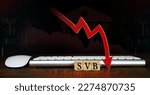 Small photo of SVB (Silicon Valley Bank) with keyboard and mouse, stock market chart, and red arrow pointing down. biggest bank in Silicon Valley, stocks fall.