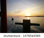 Small photo of Summer Sunset from Boat with Sillohueted Rope Tie Off and Rail on Clew Bay Ferry West of Ireland Will Atlantic Way