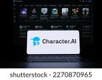 Small photo of Character AI logotype seen on smartphone screen. Blurred Character.AI website on the background. Stafford, UK, March 5, 2023