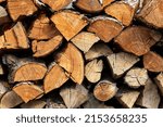 Chopped stacked firewood close up.