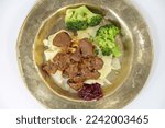 Small photo of venison ragout with ribbon noodles and broccoli nobly served on a plate
