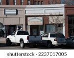 Small photo of GLOBE, AZ, USA - FEB 6, 2015: Businesses on N Broad St. in downtown Globe include Cindy's Forever Flowers and B and G Electronic Repair.