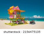 Small photo of Miami Beach Florida. Beach lifeguard station or tower. Miami South Beach FL. Atlantic Ocean. Summer vacations in Florida. Beautiful Turquoise color of ocean salt water. Florida Tropical nature.