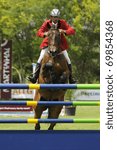 Small photo of PORTIMAO, PORTUGAL - JUNE 13: Unidentified participant in action at International Show Jumping CS4 Portimao on June 13, 2010 in Portimao, Portugal.