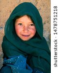 Small photo of Bamyan (Bamiyan) / Central Afghanistan - 19 Aug 2005: This poor girl lives in the caves in Bamyan (Bamiyan), Afghanistan. A cave dweller in the cliffs near to the Bamyan (Bamiyan) Buddhas, Afghanistan