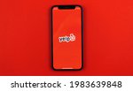 Small photo of Kharkov, Ukraine - May 28, 2021: Yelp application logo on the Apple iPhone 12 screen with red background, Yelp app social network and services