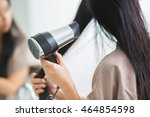 Woman With A Hair Dryer To Heat ...