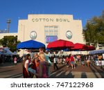 Small photo of DALLAS, TEXAS—OCTOBER 2017: People mill around the Cotton Bowl stadium at the State Fair of Texas carnival grounds while a football game was in progress inside.