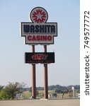 Small photo of PAOLI, OKLAHOMA—APRIL 217: Colorful sign outside the Washita Casino along Interstate 35 in Paoli, Oklahoma.