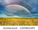 Rainbow Over Stormy Sky. Rural...