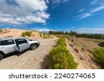 Small photo of Vacation with a rental car. 4x4 off-road Jeep Renegade on dirt road on Rhodes island. Typical greek landscape. Greece. October 09, 2022