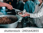 Small photo of Giving free food to the poor by humane people