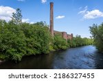 Blackstone River Valley National Historic Park. Ashton Mill brick smokestack. Former cotton mill now apartments for Providence area. Village remains example of a Rhode Island System mill village.