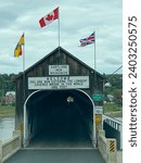 Small photo of Hartland, New Brunswick -Jun 1, 2023: The Hartland Covered Bridge is the world's longest covered bridge. It crosses the Saint John River from Hartland to Somerville, New Brunswick, Canada.