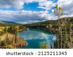 Stunning Miles Canyon outside of Whitehorse in Yukon Territory during September with yellow fall colours in stunning, scenic tourism location of northern Canada. 