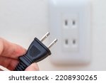 Power plug and electric outlet