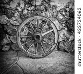 Old Wooden Cart Wheel Against...