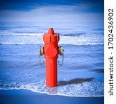 Small photo of An improbable hydrant at the seaside. Plenty of water: concept image