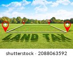 Small photo of Property Land Tax on vacant plot - real estate concept with a vacant land on a green field available for building construction and Land Tax text