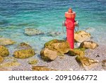 Small photo of An improbable hydrant at the seaside - Plenty of water concept image