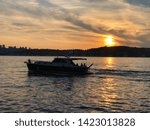 Small photo of a ship going ashore and sunset