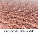 Small photo of A plowed field in autumn. Close-up of plowed land. A close-up of a plowed field.