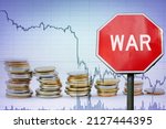 Small photo of War sign on economy background - graph and coins. Economic crisis because of armed conflict.