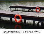 Wooden Pier With Lifebuoys....