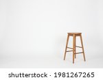 Brown wooden stool on clean...