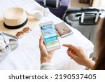 Woman search ticket reservation for holiday. Girl using travel application for flight tickets and hotel room online booking. Online travel agency hotel flight ticket booking, travel planning concept.