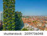 Small photo of Aerial view of Milan Porta Nuova district with Vertical forest buildings. Residential buildings with many trees and other plants in balconies