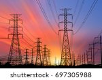 Silhouette High voltage electric tower on sunset time and sky on sunset time background.