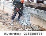 A Worker With A Jackhammer At A ...