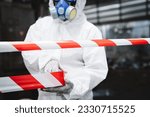 Small photo of Close up hand of workers wear protection suit checking chemical contaminated oil in old factory. Red and White Lines Marking a Dangerous Zone. Biohazard Contamination Control.