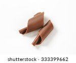 pair of chocolate shavings on white background