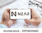 Small photo of Logo of NEAR Protocol in tablet. Cryptocurrency coin token. Trading blockchain platform to buy,sell on decentralized exchange DEX,DEFI. Digital money.Business,investing.