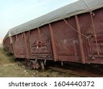 Derailed train Wagons covered with tarpaulin at a railway track due to broken line