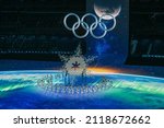 Small photo of BEIJING, CHINA - FEBRUARY 04: A view inside the stadium as the large snowflake and Olympic ring logo is seen while performerâ€™s dance during the Opening Ceremony of the Beijing 2022 Winter Olympics
