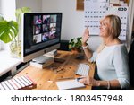 Small photo of Online training teacher. Day to day new normal office Work from home. Smiling mature woman having video call via laptop in the studio flat office. Daily routine. Business video conferencing.