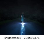 A Woman Walking At Night And...