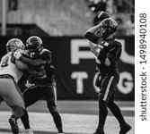 Small photo of Toronto, Canada - Aug 1, 2019: Toronto Argonauts Quarterback McLeod Bethel-Thompson (4) getting set to throw during Winnipeg Blue Bombers at Toronto Argonauts game at BMO Field in Toronto, ON