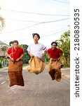 Small photo of Indonesian people celebrate Indonesian independence day on 17 August with a sack race. Indonesian independence day