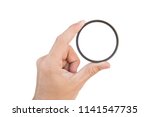 hand holding clear camera filter isolated on white with clipping path
